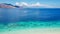 Maumere - Idyllic white sand beach with some other island in the back