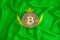 Mauritania flag, bitcoin gold coin on flag background. The concept of blockchain, bitcoin, currency decentralization in the