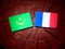 Mauritania flag with French flag on a tree stump isolated