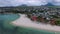 Mauritius island and Flic en Flac beach Indian Ocean Coastline. Sandy Beach and Yachts Boats and People in Background