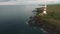 Mauritius island and rocky coastline in background. Lighthouse. Phare d`Albion