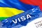 Mauritius Visa in passport. USA immigration Visa for Mauritius citizens focusing on word VISA. Travel Mauritius visa in national