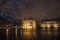 The Mauritshuis seen from de Hofvijver in the Hague at night, covered by snow.