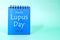 May 10 as World Lupus Day date reminder on blue desk calendar. Celebration concept.