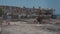 May 11, 2021 Cyprus, Paphos. Construction machinery during road repair work at construction site near harbor in Paphos