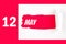 May 12nd. Day 12 of month, Calendar date. Red Hole in the white paper with torn sides with calendar date. Spring month, day of the