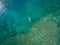 May 15 2016, Haleiwa Hawaii. Aerial view of an unknown Stand up Paddle boarder surfing in the Ocean
