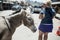 MAY 15 2018 - OATMAN, ARIZONA: Woman tourist feeds a wild burro on the streets of Oatman Arizona, along Route 66