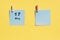 May 17st . Day of 17 month, calendar date. Two blue sheets for writing on a yellow background. Top view, copy space. Spring month