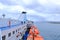 May 20 2023 - Olbia, Sardinia, Italy: : the ferry approaching the the port of Olbia on a cloudy day