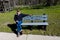 MAY 20, FORT MANDAN, NORTH DAKOTA, USA - Photographer Joe Sohm sits on Thomas Jeffersion quote on bench about mission to explore