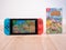 May 2020, UK: Nintendo switch console and animal crossing new horizons bundle on white