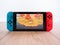 May 2020, UK: Nintendo switch games console animal crossing new horizons on wooden floor