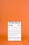 May 2024 table calendar on orange color background