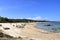 May 23 2023 - Arbatax, Sardinia, Italy: people at the hakuna matata beach with white sand and crystal clear water