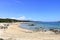 May 23 2023 - Arbatax, Sardinia, Italy: people at the hakuna matata beach with white sand and crystal clear water