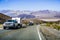 May 28, 2018 Death Valley / CA / USA - Pick up trucks with RV travel trailers driving though Death Valley National Park; Panamint