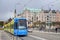 May Sunday walk in the center of Stockholm, a city tram