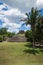 Maya ruin `El Castillo` with palm trees at the archeological site Xunantunich near San Ignacio, Belize