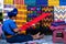 Maya woman is weaving with her waist loom on a street in San Antonio Palopo Guatemala.