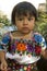 Mayan girl dressed in traditional embroidered costume