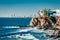 Mazatlan as seen from afar with a spectacular cliff line in the foreground