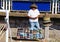 Mazatlan, Mexico - November 8, 2022 - A local salesperson offering colorful sunglasses for sale