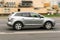 Mazda CX-7 SUV vehicle on the city road. Fast moving silver color car on Moscow streets. Accelerating with low-emission.