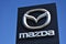 Mazda emblem, sign, logo and blue sky background