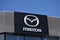 Mazda emblem, sign, logo on the facade of the Warszawa Mazda Nivette car dealer salon