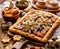 Mazurek pastry, traditional Polish Easter cake made of shortcrust pastry,  chocolate cream, candied fruit, nuts and almonds