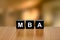 MBA or Master of Business Administration on black block