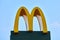 McDonalds logo roadside sign of fast food restaurant branch, yellow macdonald logo road sign