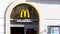 McDonalds restaurant signboard, brand symbol, logo closeup, frontal shot, building facade McDonald`s fast food restaurant