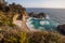 Mcway falls - Pacific coast highway in Big Sur, California, USA in the afternoon with wild flowers