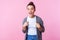 This is me? Portrait of joyful surprised brunette teen girl pointing at herself, looking amazed. isolated on pink background