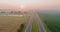 Meadow across high speed highway in the morning in the thick fog natural landscape over the panorama landscape view in