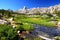 Meadow against mountain wall