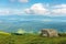 Meadow with boulders in Carpathian mountains in su