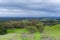 Meadow and hills on a cloudy and rainy day in Rancho San Antonio county park; San Jose and Cupertino in the background, south San