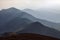 From the meadow opens a panoramic view of the mountains. Fantastic spring scenery. Touristic resort Carpathian, Ukraine, Europe.