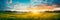 Meadow Sunrise scenic panorama with a sun-kissed meadow, showcasing the beauty of morning light.