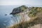 Meadows and the blue sea - Durdle Door, Dorset, England.