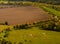 Meadows, famsland and grounds with cows seen from above