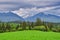 Meadows over Hybe village and West Tatras mountains