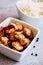 Meal with caramelized chicken pieces in a bowl