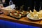 Meal. Festive buffet table for guests. Assortment of cold cuts,canapes on wooden skewers, festive snacks with fruits and