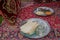Meal in Iran - Grilled fish with a salad, yogurt, eggs, flat bread and ri