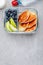 Meal prep containers with pancakes, blueberry and apple. Breakfast in lunch box. Top view