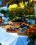 Meals on table of abundance as a part of natural wedding ceremony held in nature.